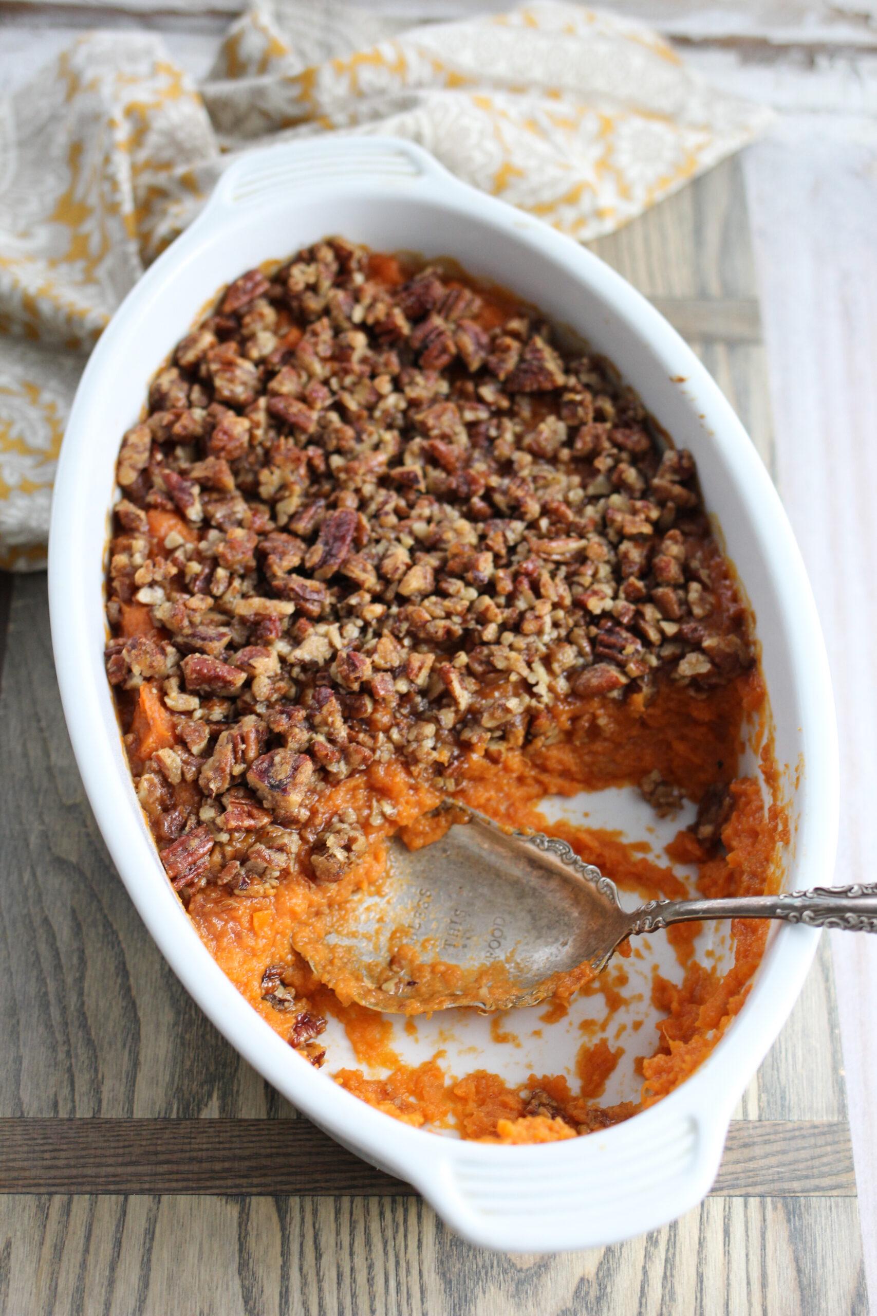 Overhead shot of a golden-brown Southern sweet potato casserole with a generous pecan topping, ready to serve