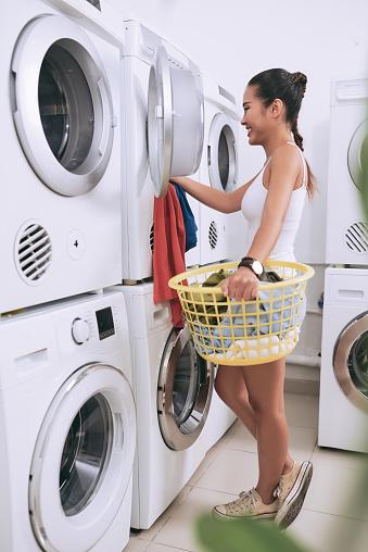 student doing laundry