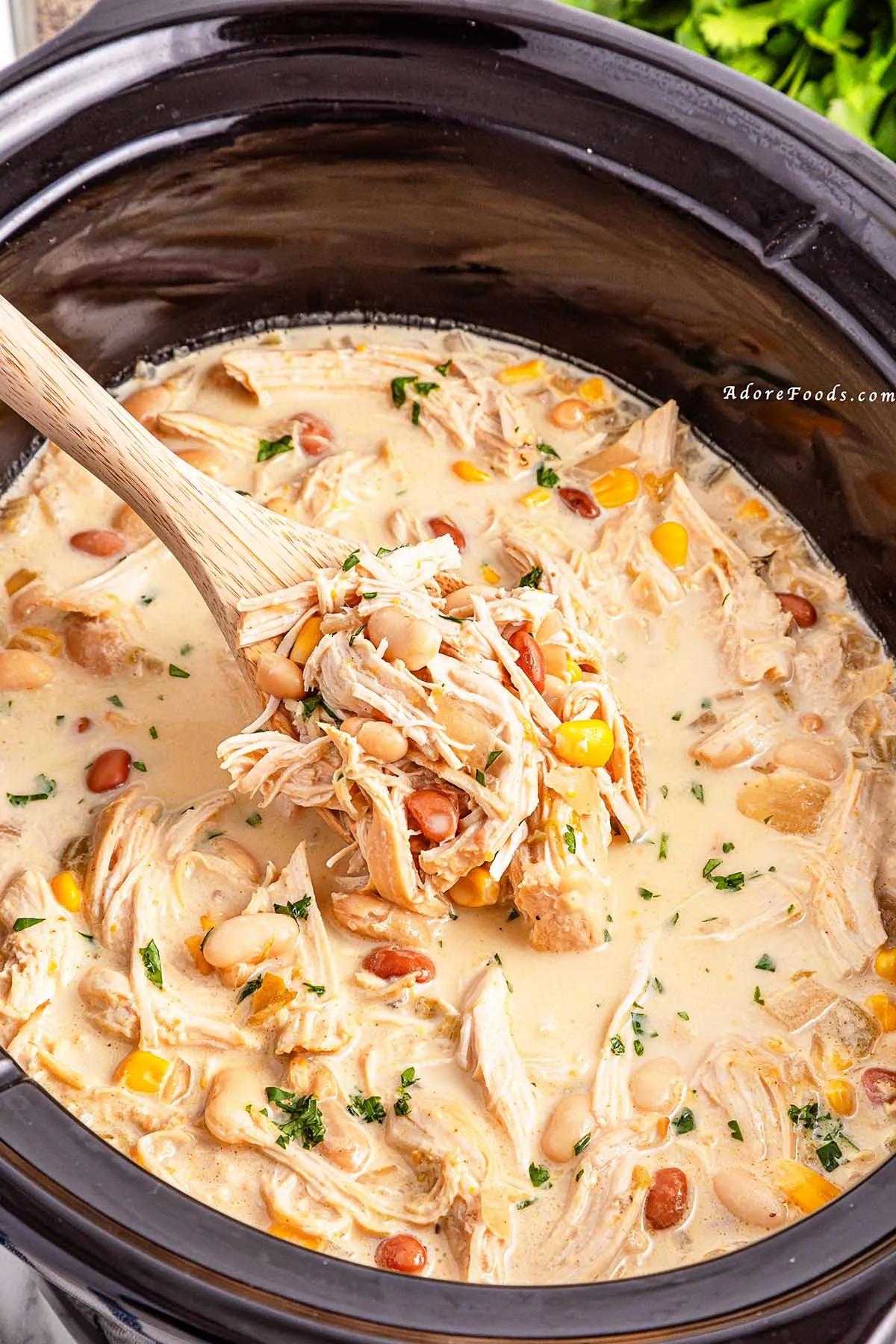 slow cooker version of white chicken chili simmering