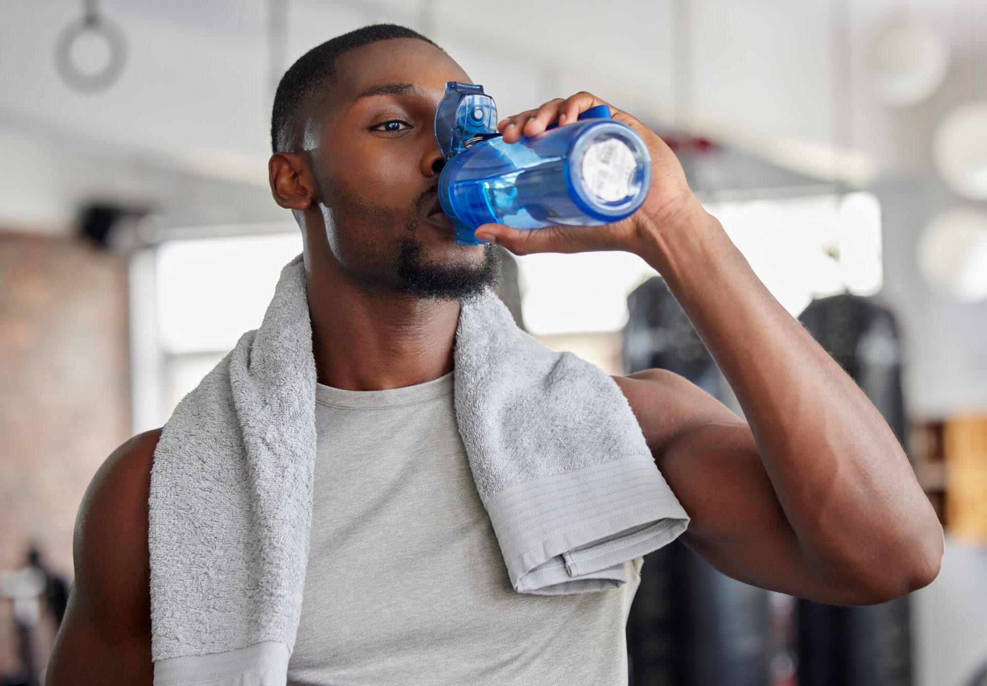 athlete drinking water during workout