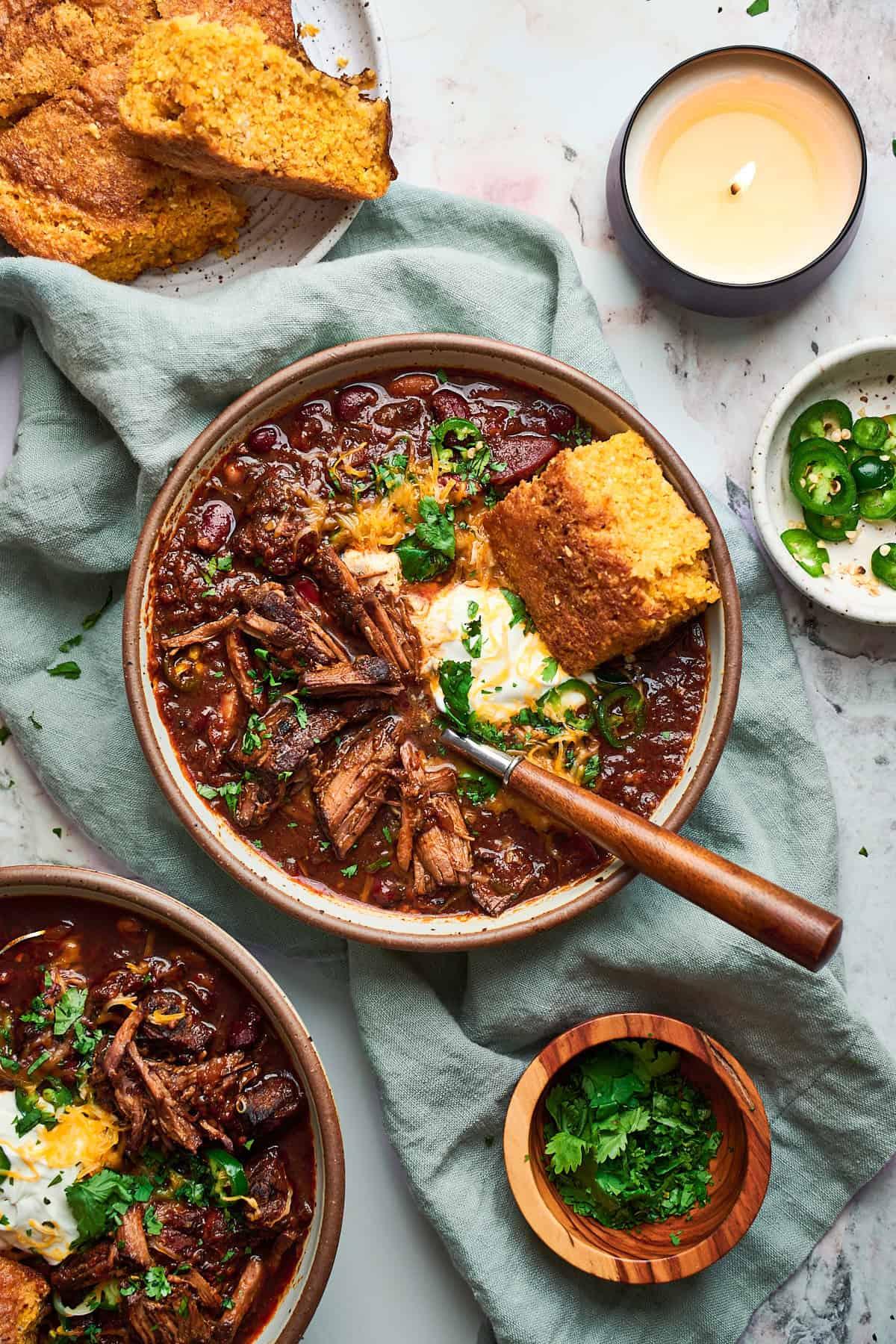 Ingredients for chili beef roast laid out on a wooden table, artistic arrangement