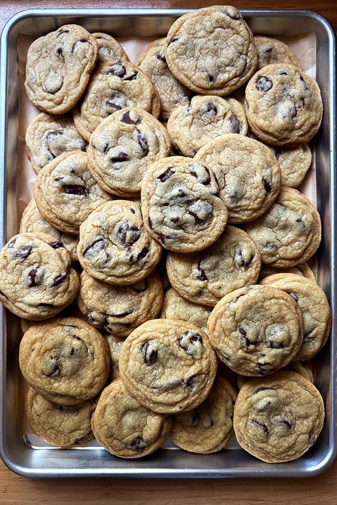 A tray of chocolate chip cookies at a bake sale