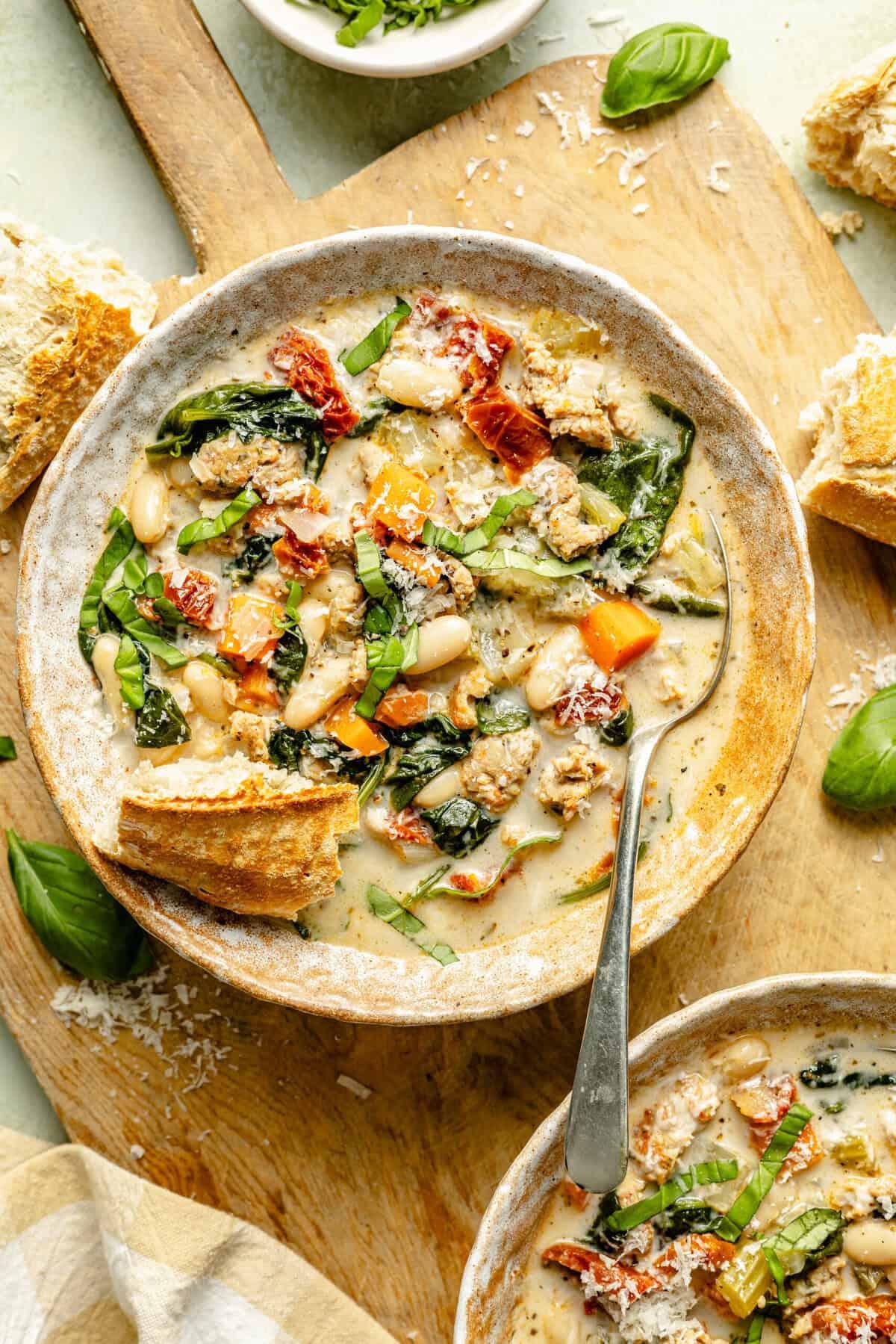 bowl of creamy Tuscan white bean soup with crusty bread