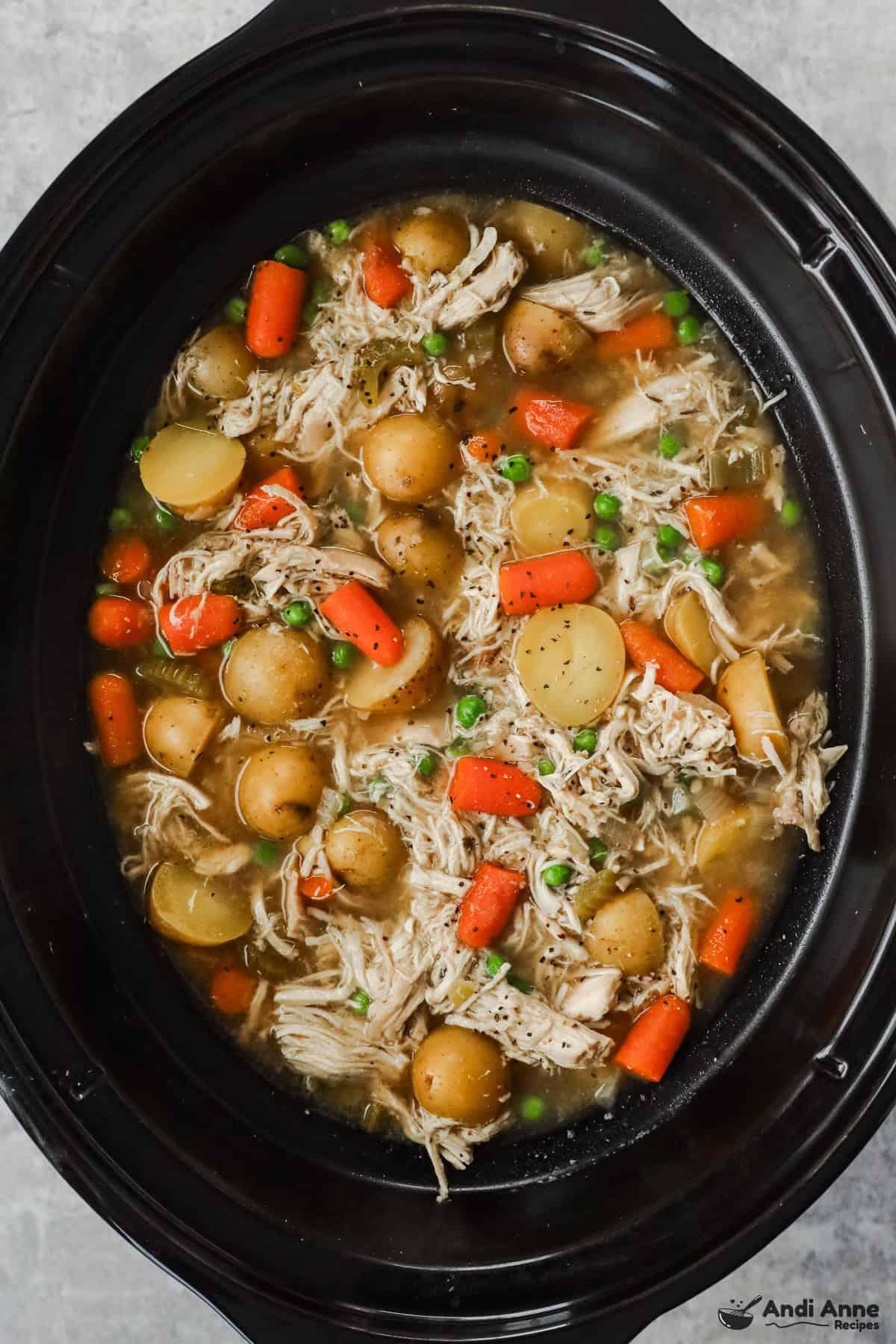 Close-up shot of chicken stew simmering in a slow cooker