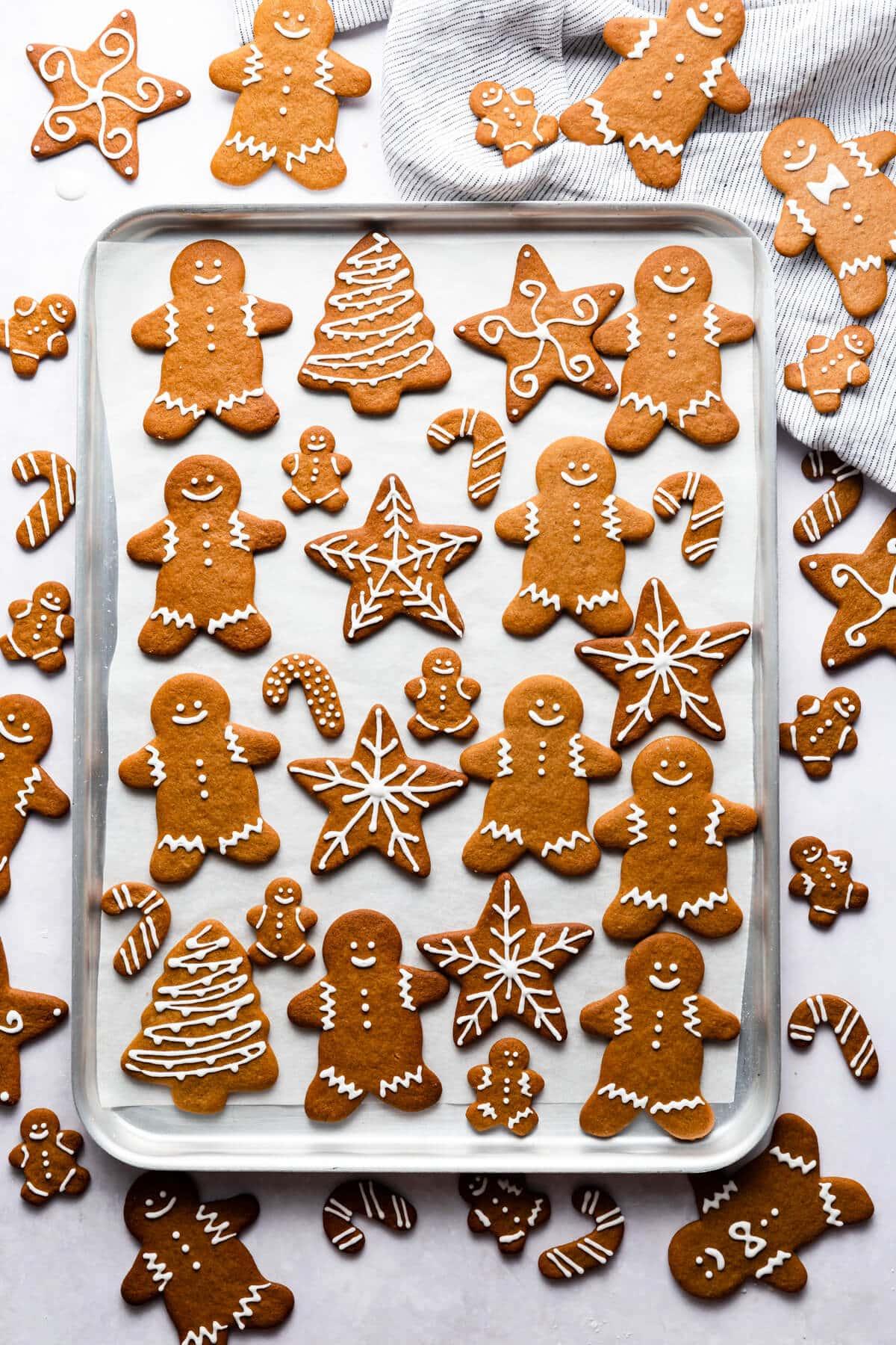 array of different shaped and decorated gingerbread cookies on a platter