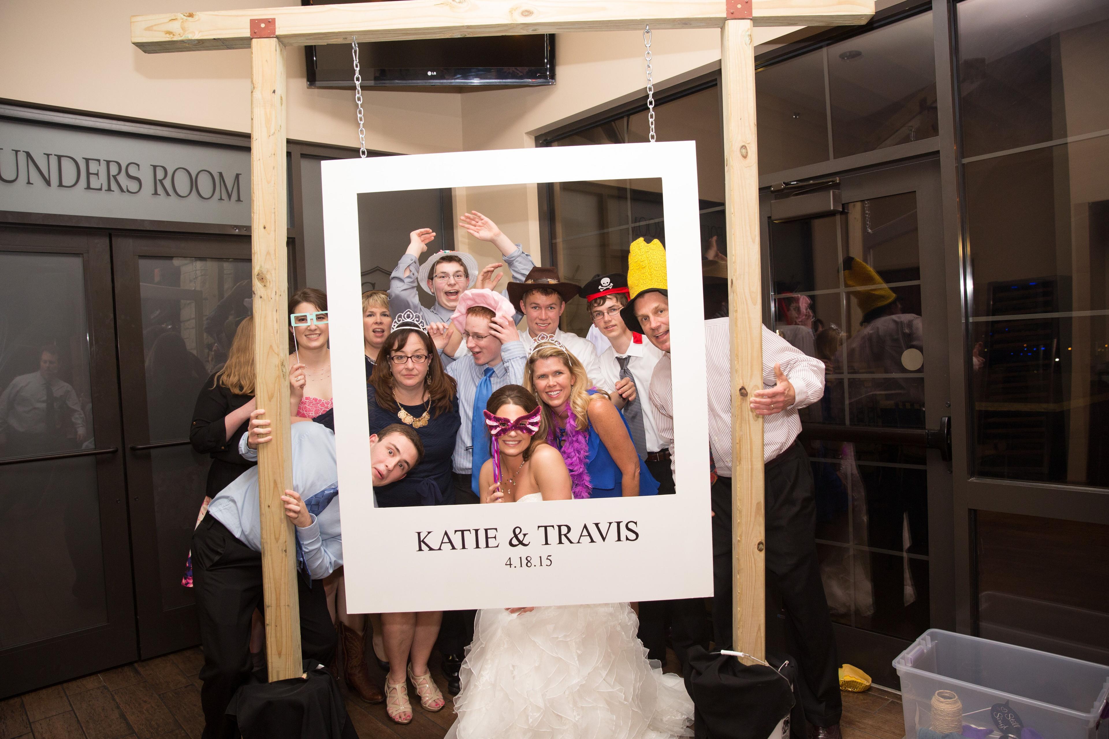 a photo booth area with props and a polaroid camera