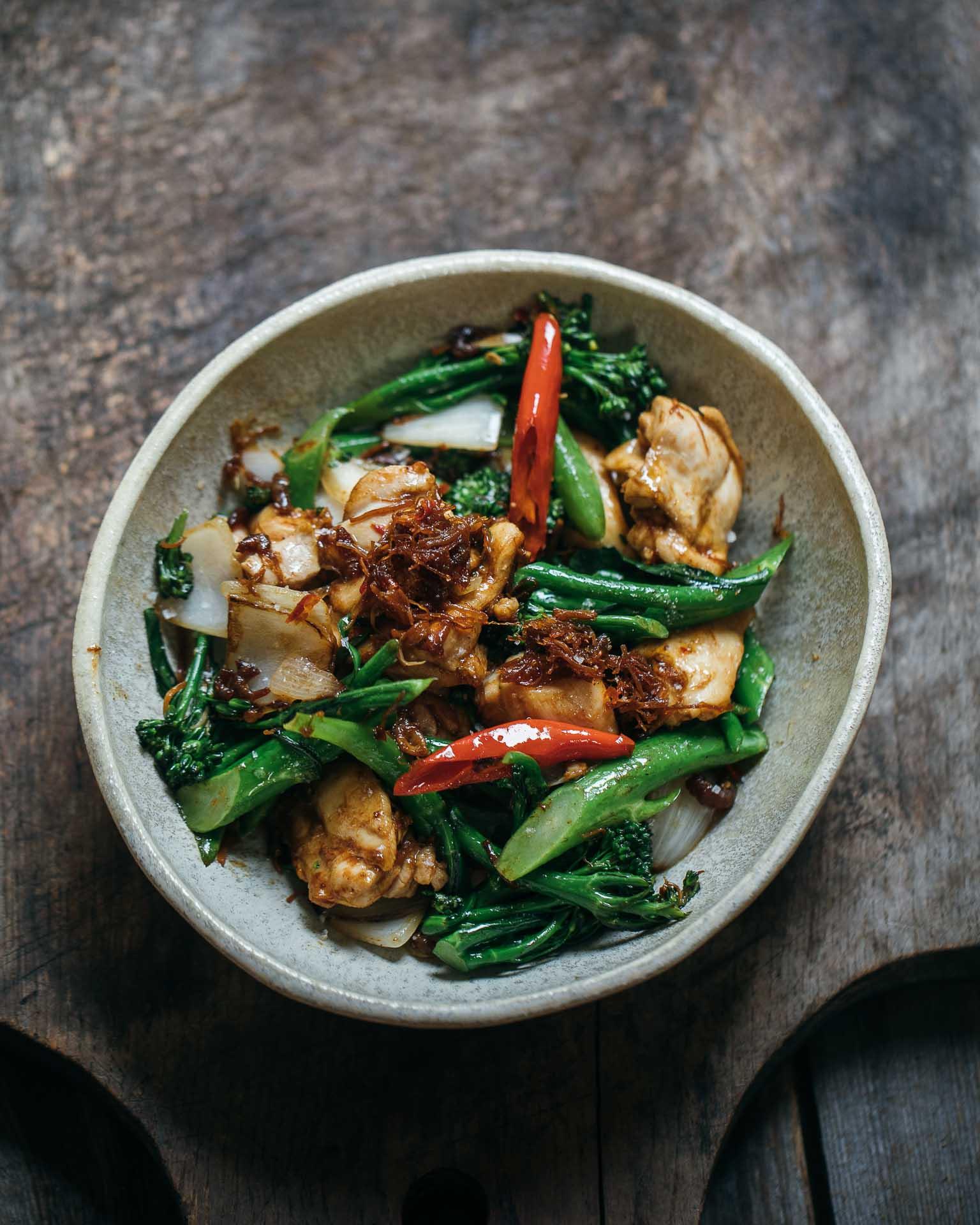 chicken thighs marinating in a bowl of XO sauce mixture