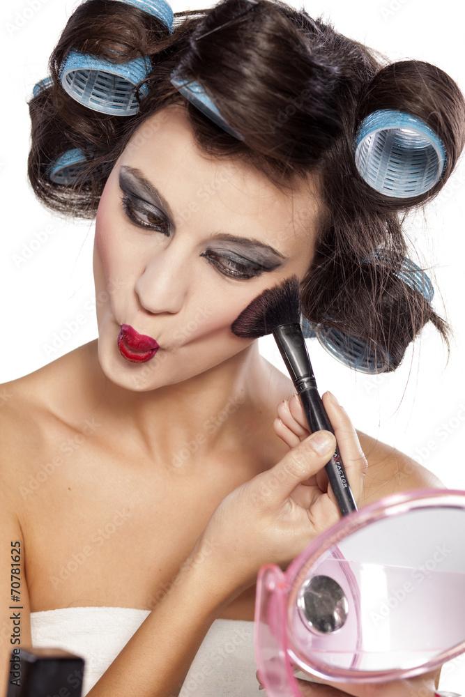 woman having fun applying makeup