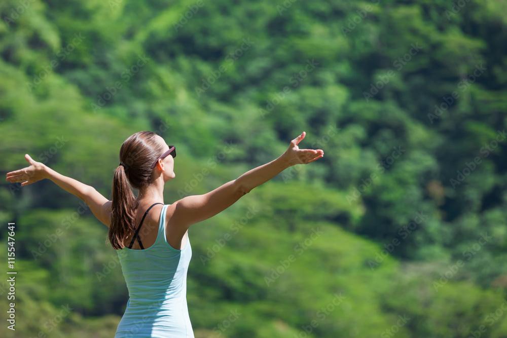 woman feeling peaceful and content in nature