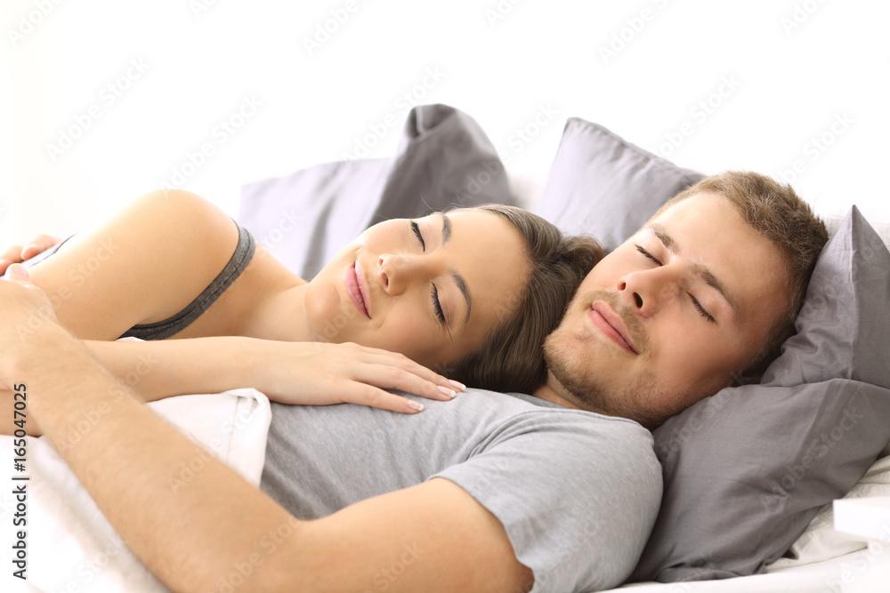 happy couple sleeping in bed