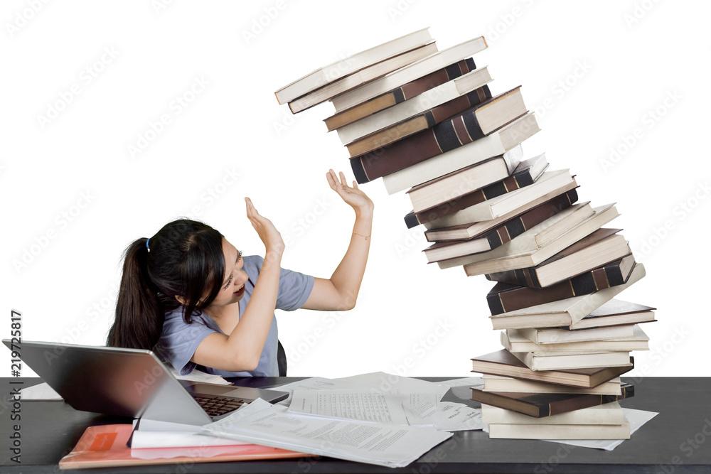 stack of notebooks falling over
