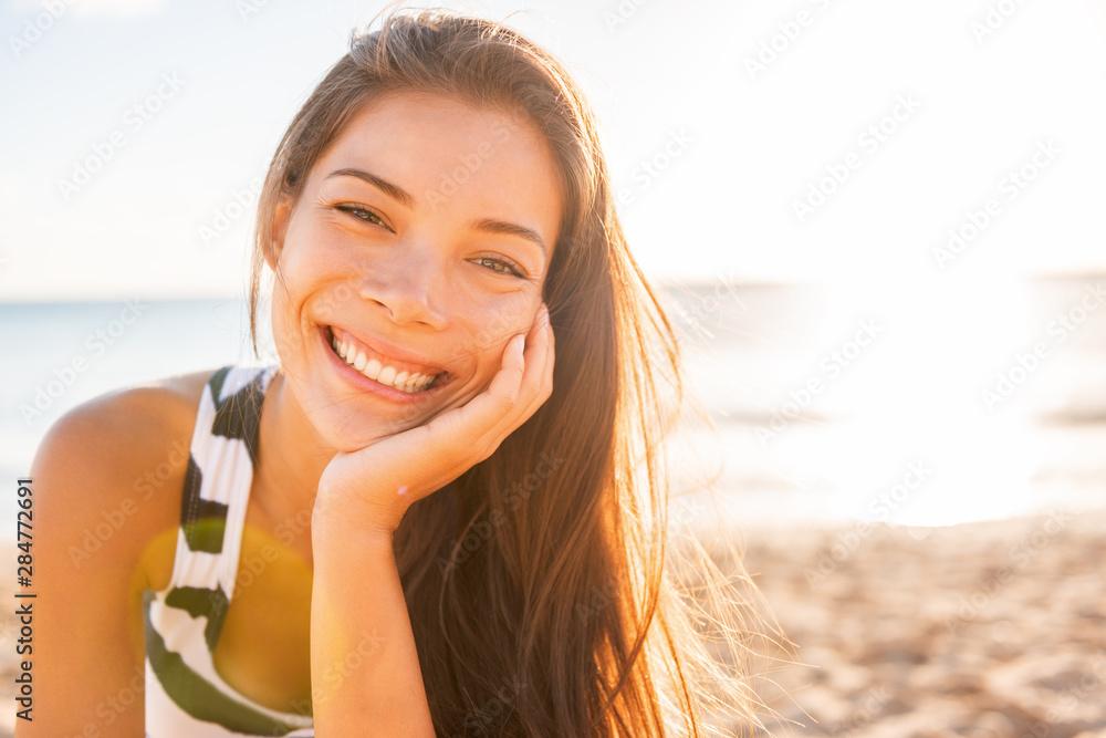 woman smiling on a summer beach