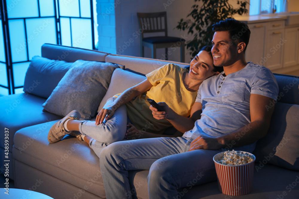 couple watching a movie on a couch