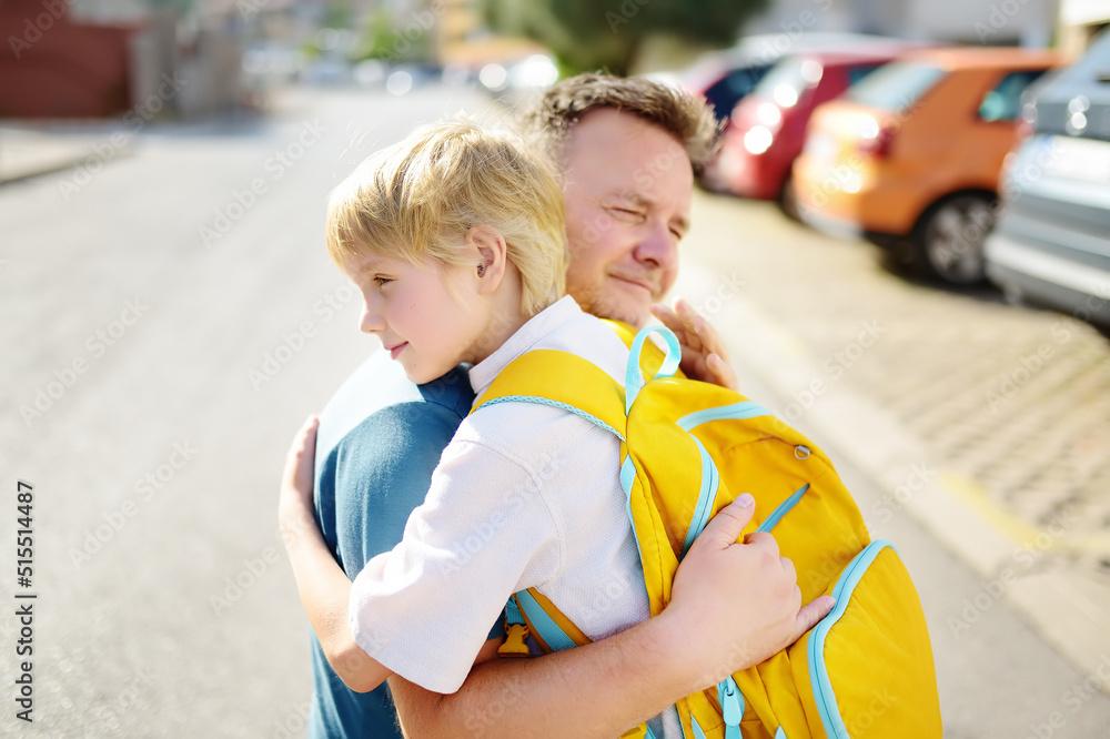 parent hugging child on first day of school