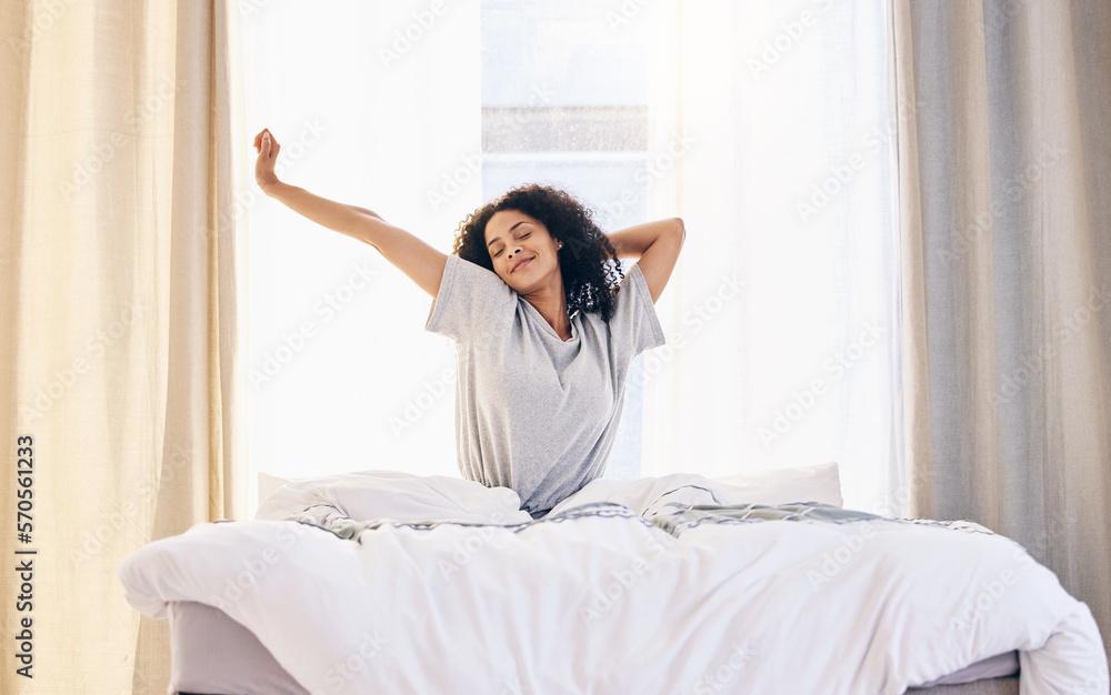 woman happily relaxing in a well-sized bed