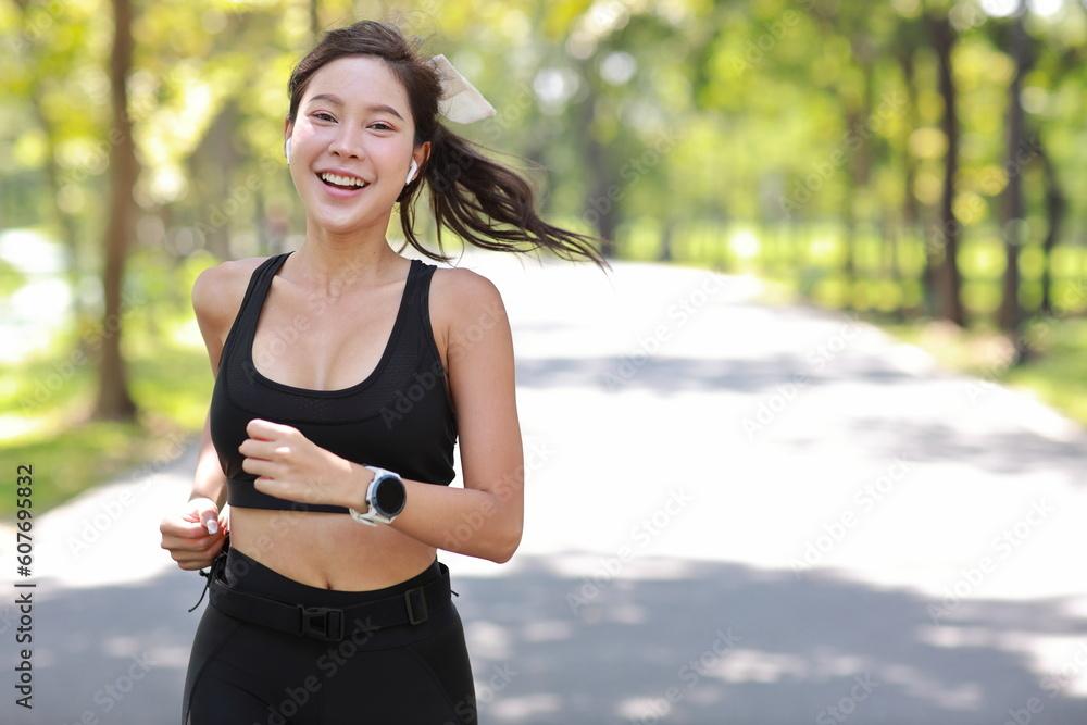 woman smiling after a run in a park
