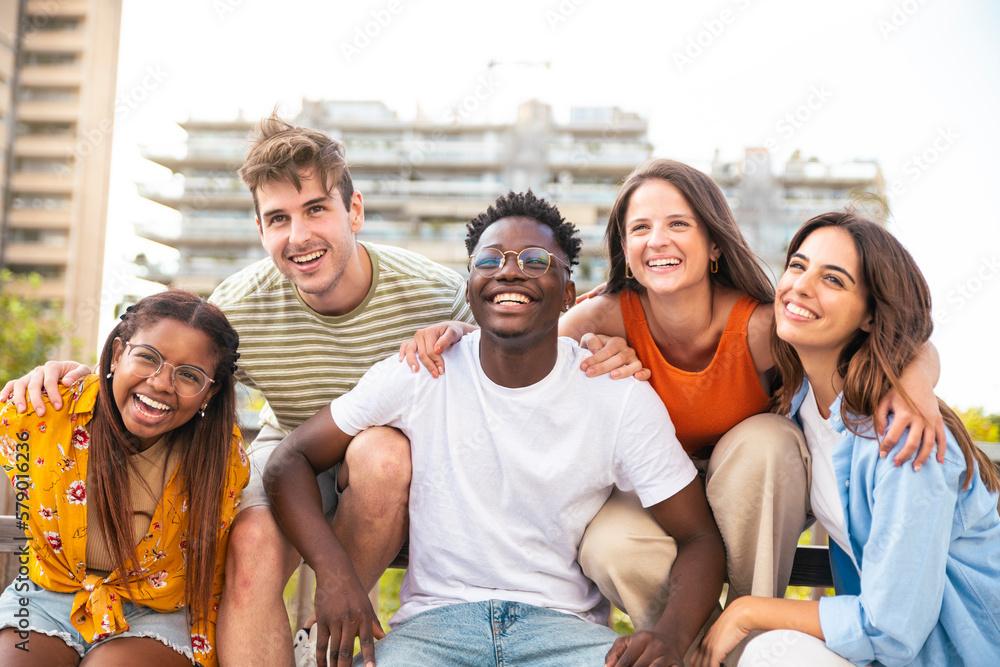 group of friends laughing together outdoors