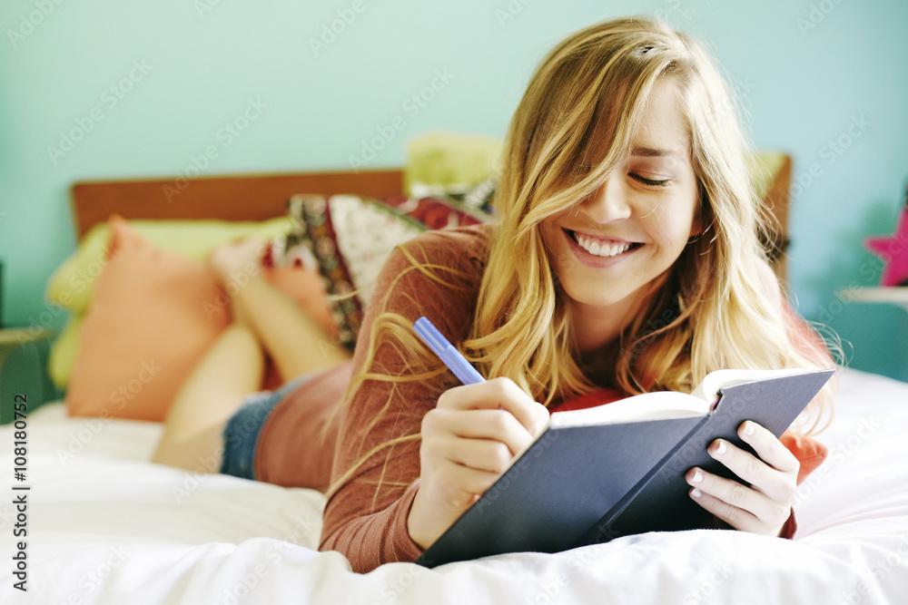 woman journaling in bed
