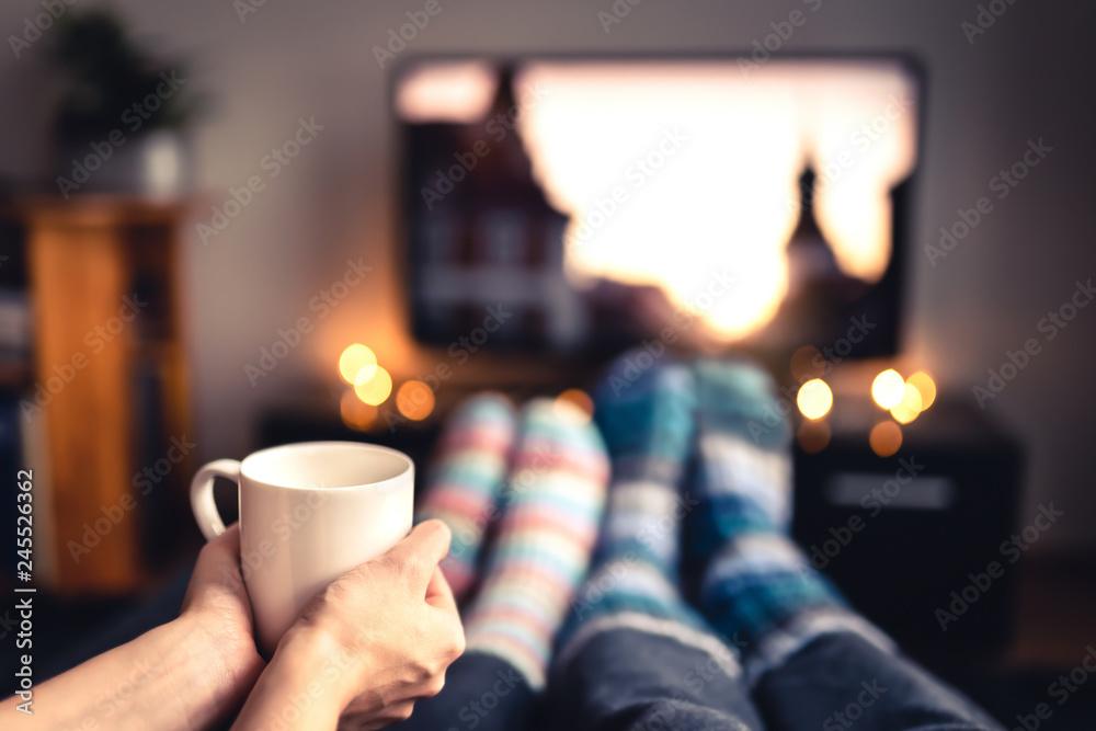 Cozy living room scene with a person holding a gourmet hot chocolate mug