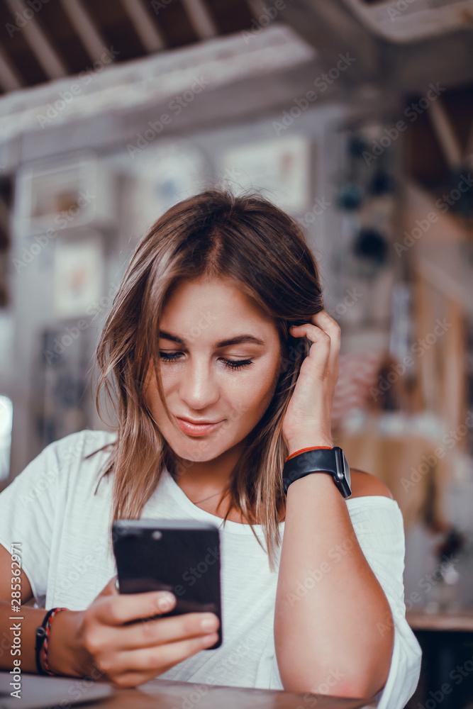 woman using phone to browse fashion inspiration on Instagram
