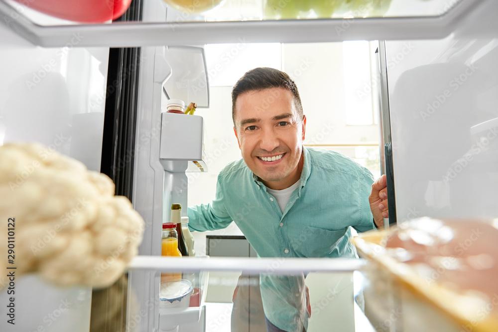 person looking tired at fridge then smiling at skillet chicken