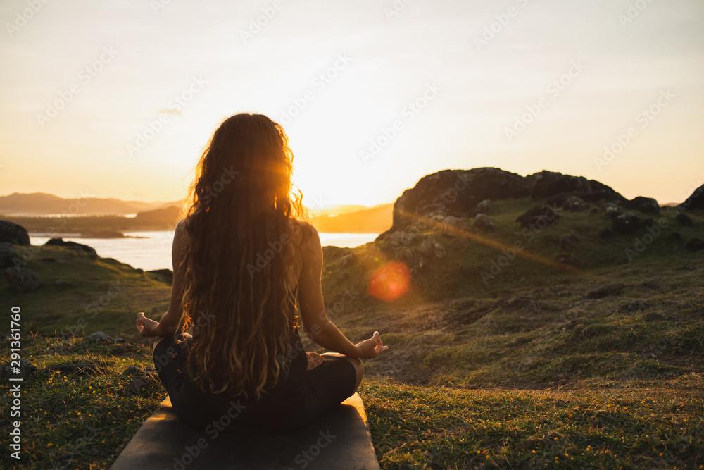 woman meditating outdoors