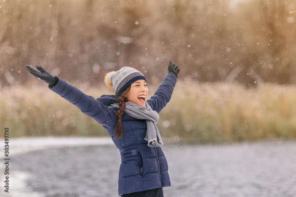 woman wearing warm gloves outside in snow
