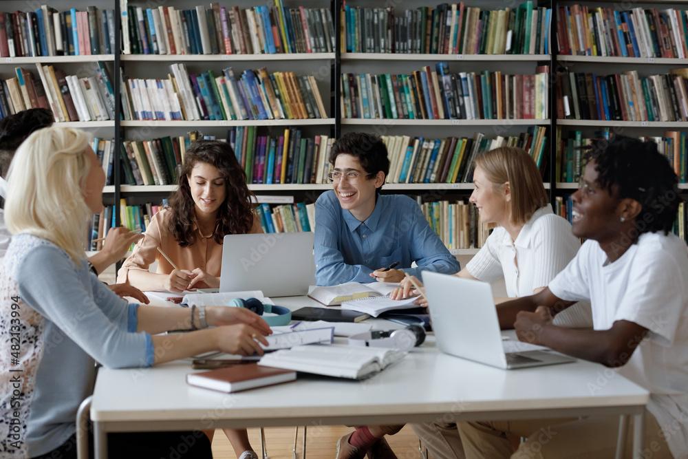group of diverse college students studying together