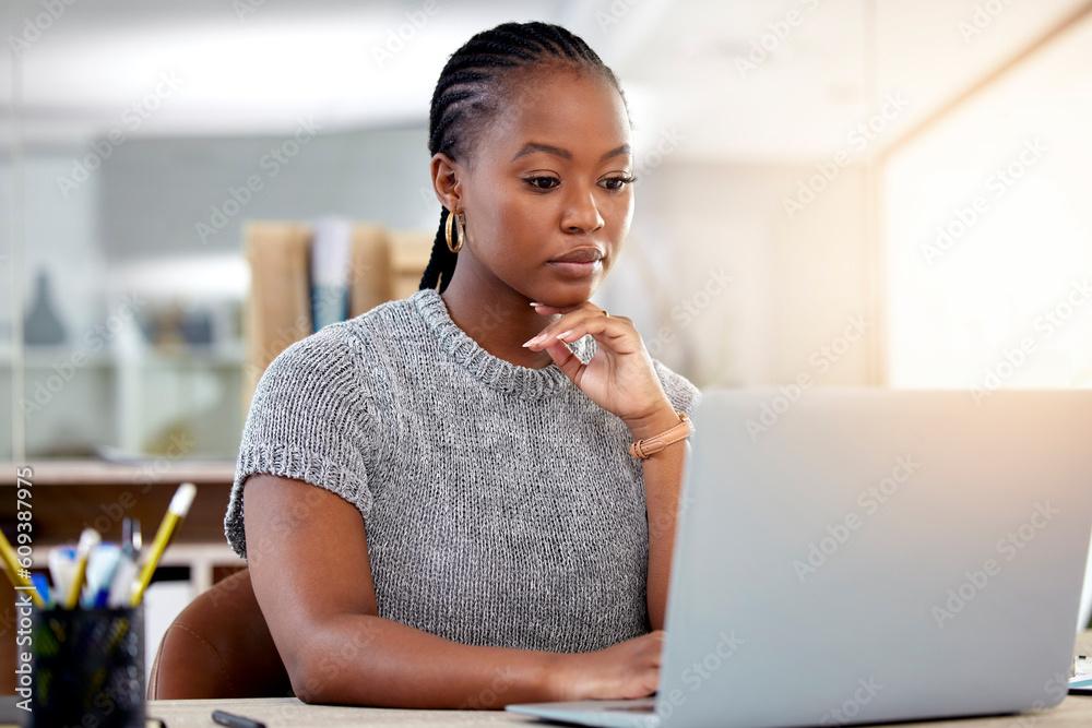 woman researching keywords on her laptop