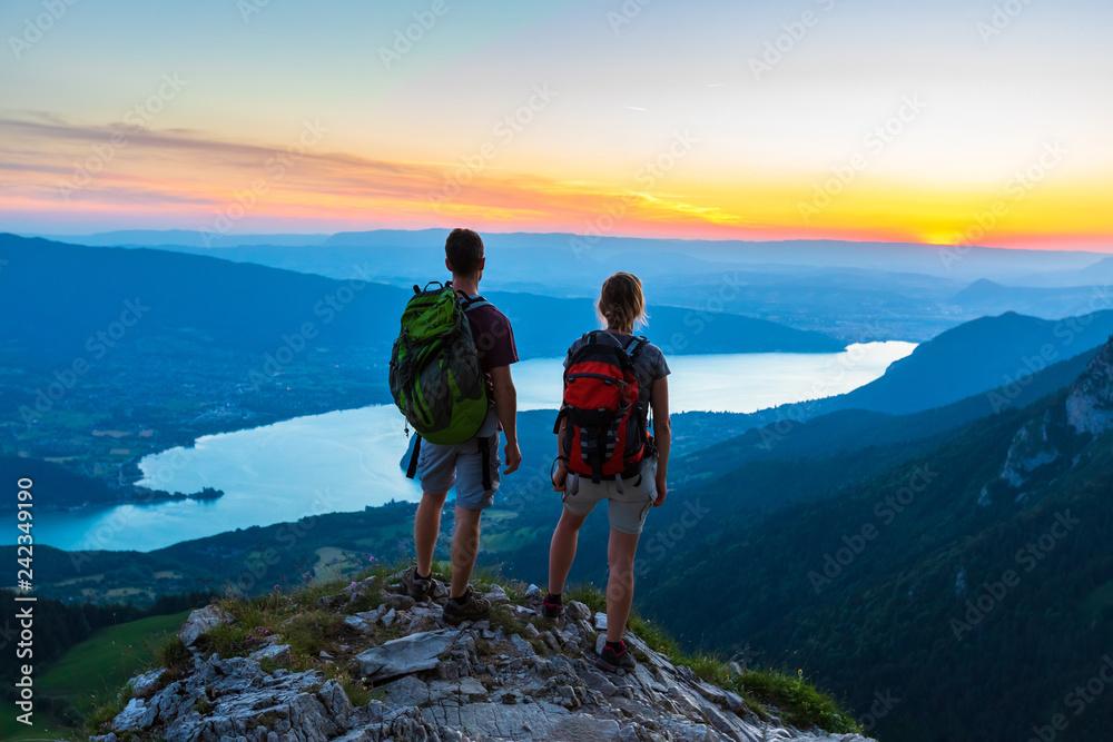 Couple hiking with sunset view