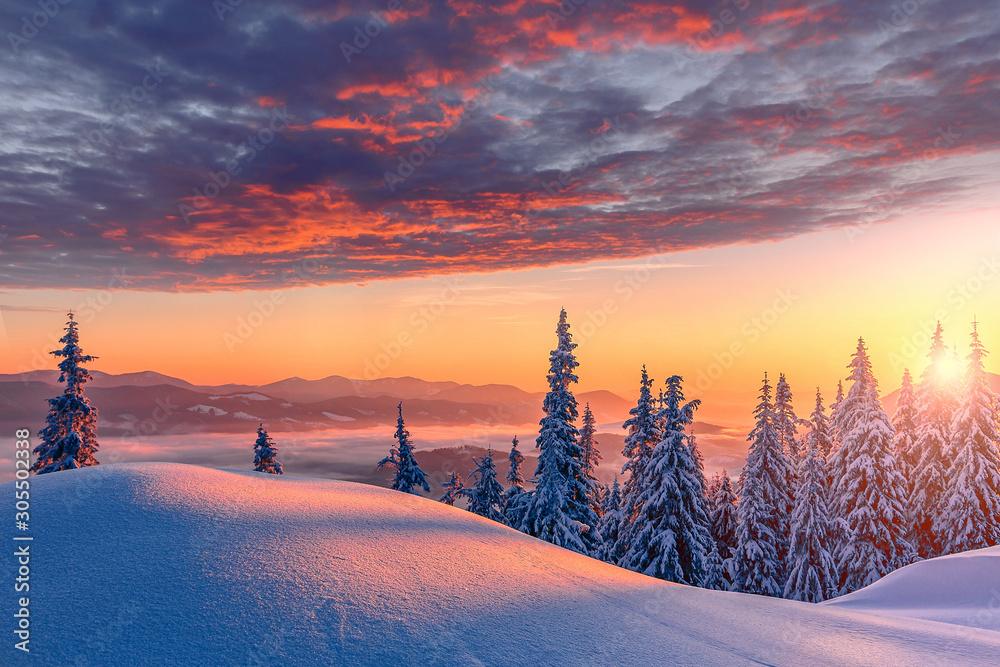 snow covered landscape at sunset