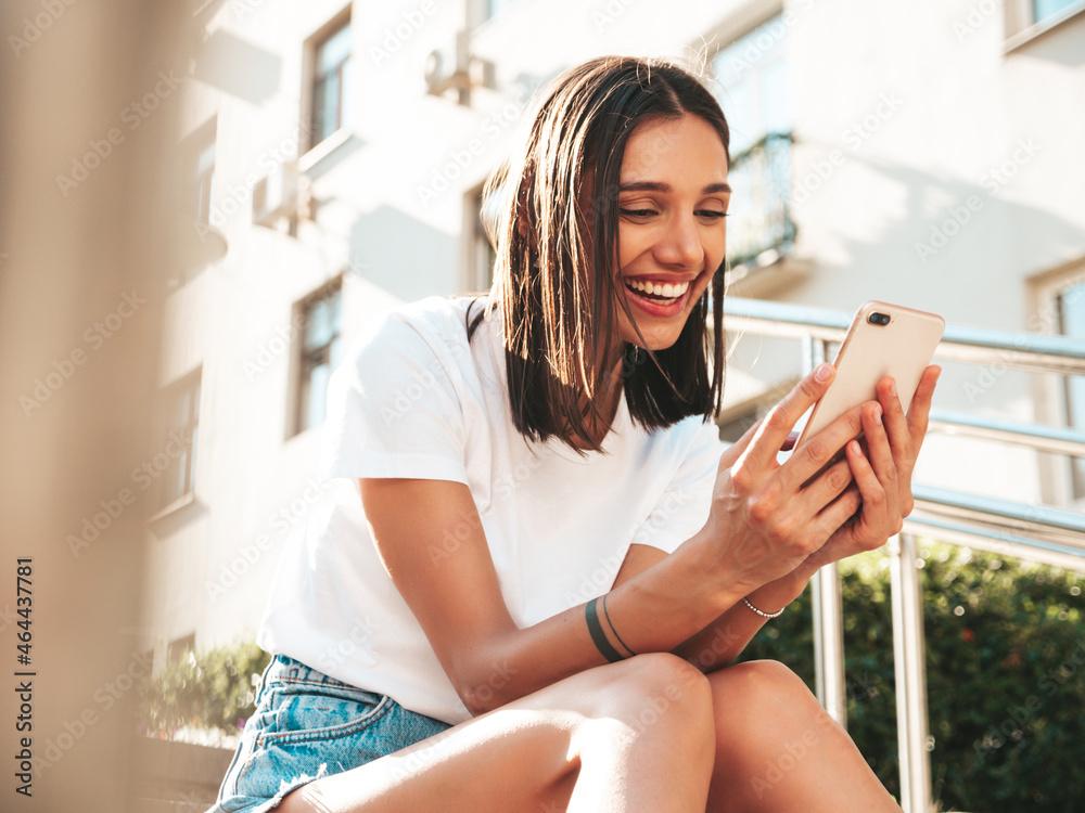 woman looking at her summer clothes, smiling