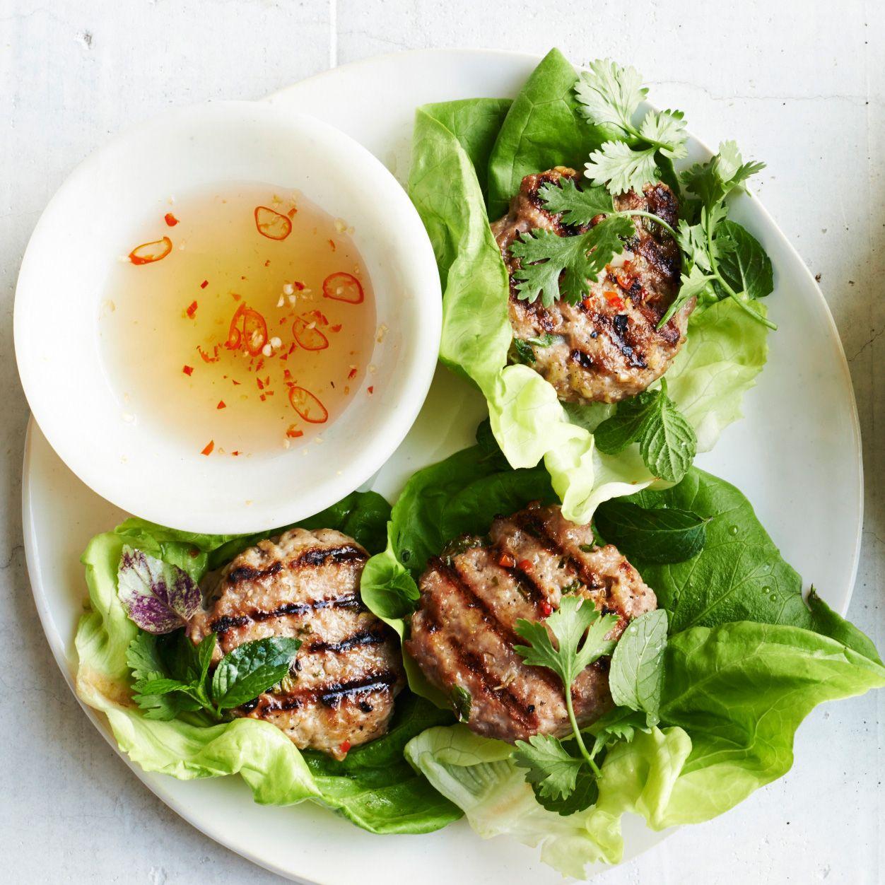 close up of lemongrass bbq pork slider with mint leaves