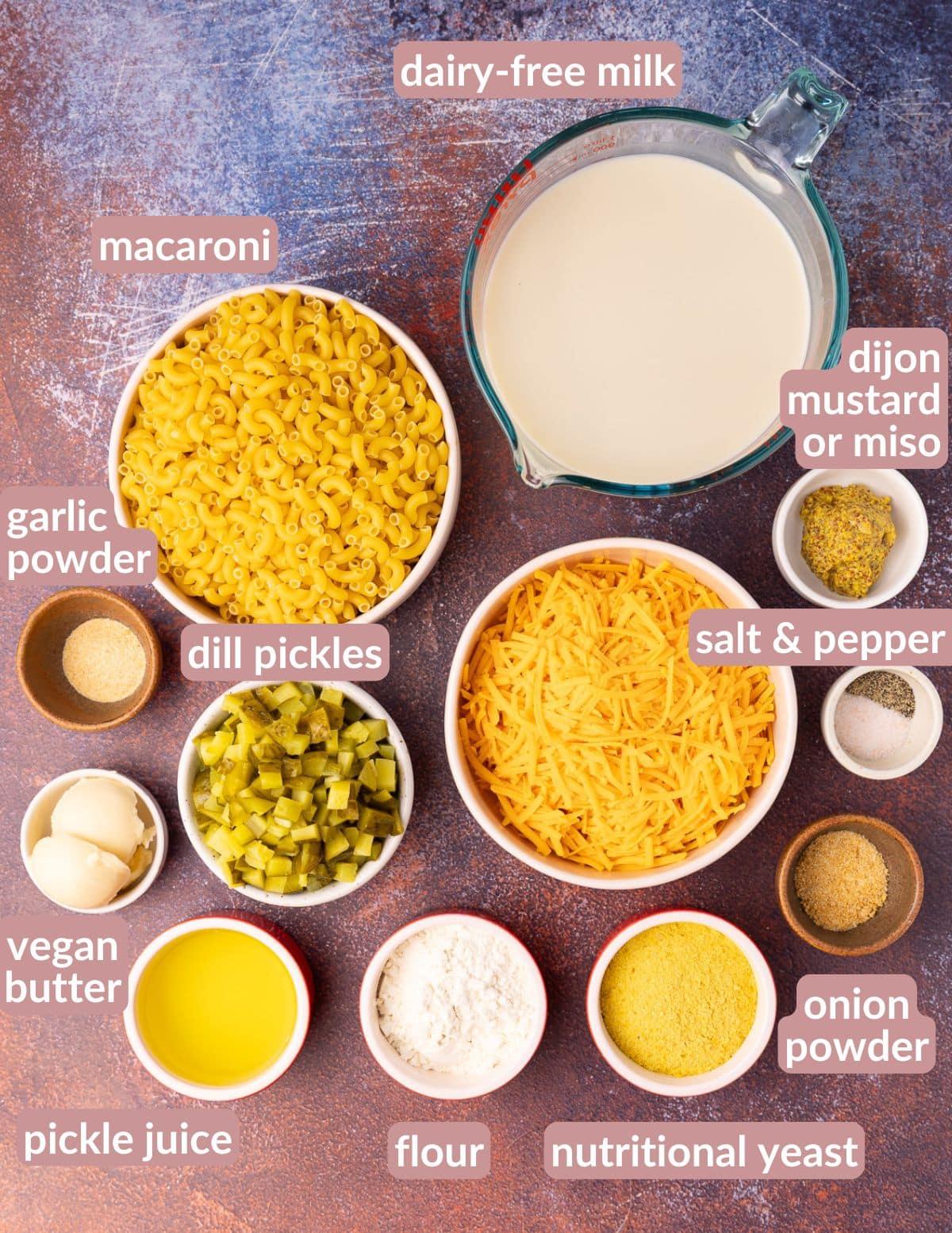 Ingredients for vegan mac and cheese with dill pickles laid out on a counter