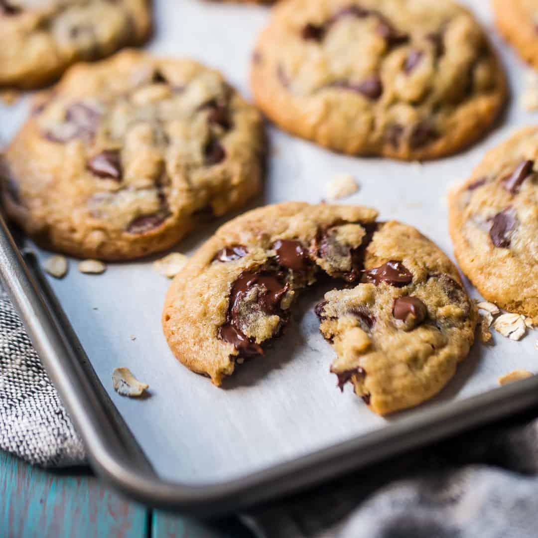 close-up of a perfectly baked oatmeal chocolate chunk cookie with a gooey center