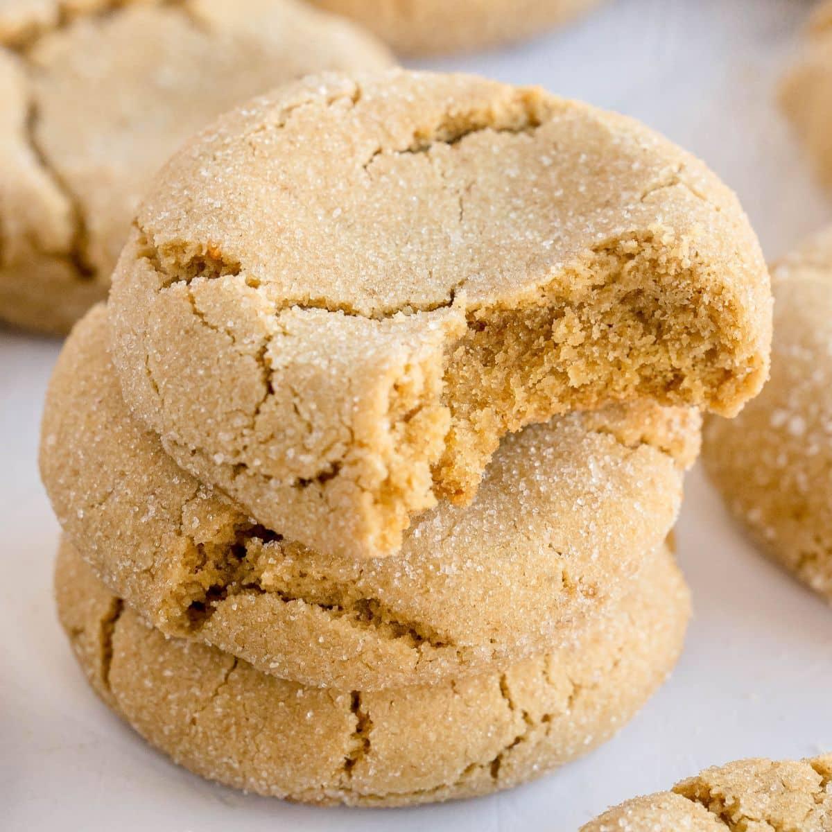 Batch of chewy brown butter cookies fresh out of the oven, golden and slightly puffed