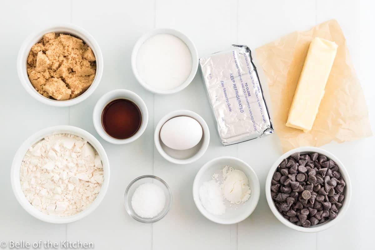 ingredients for chocolate chip cookies laid out on a kitchen counter