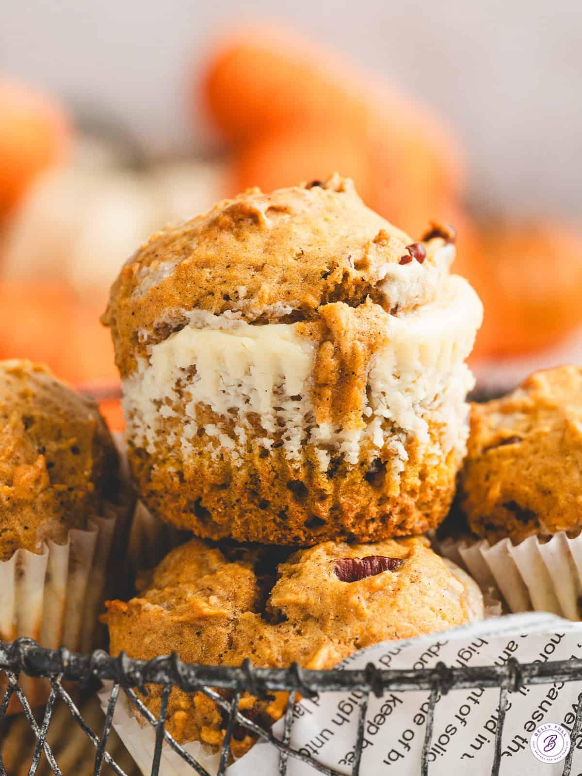 close-up of a pumpkin muffin with cream cheese filling, showing the texture
