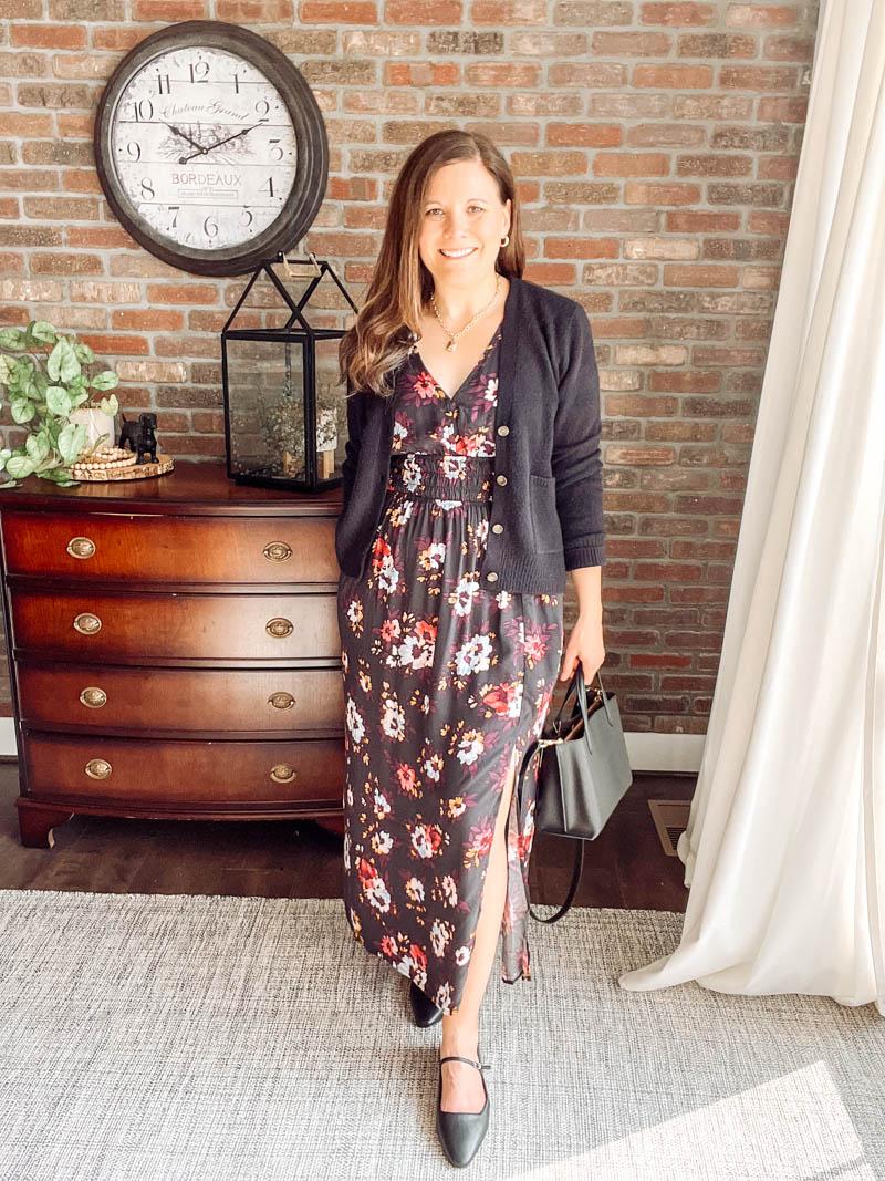 woman layering cardigan over dress