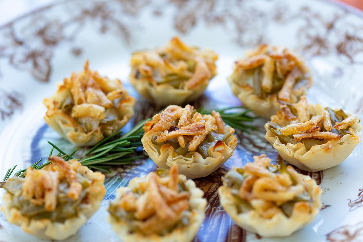 green bean casserole cups arranged on a festive platter