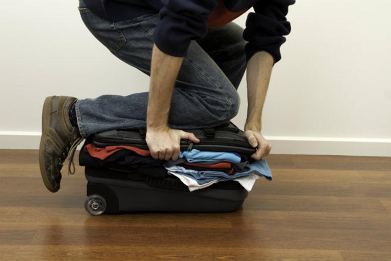person packing for a sponsored trip