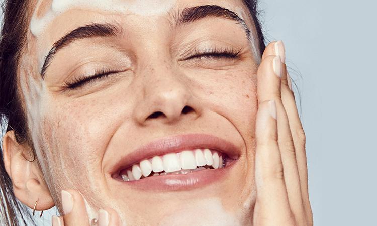 woman demonstrating double cleansing method