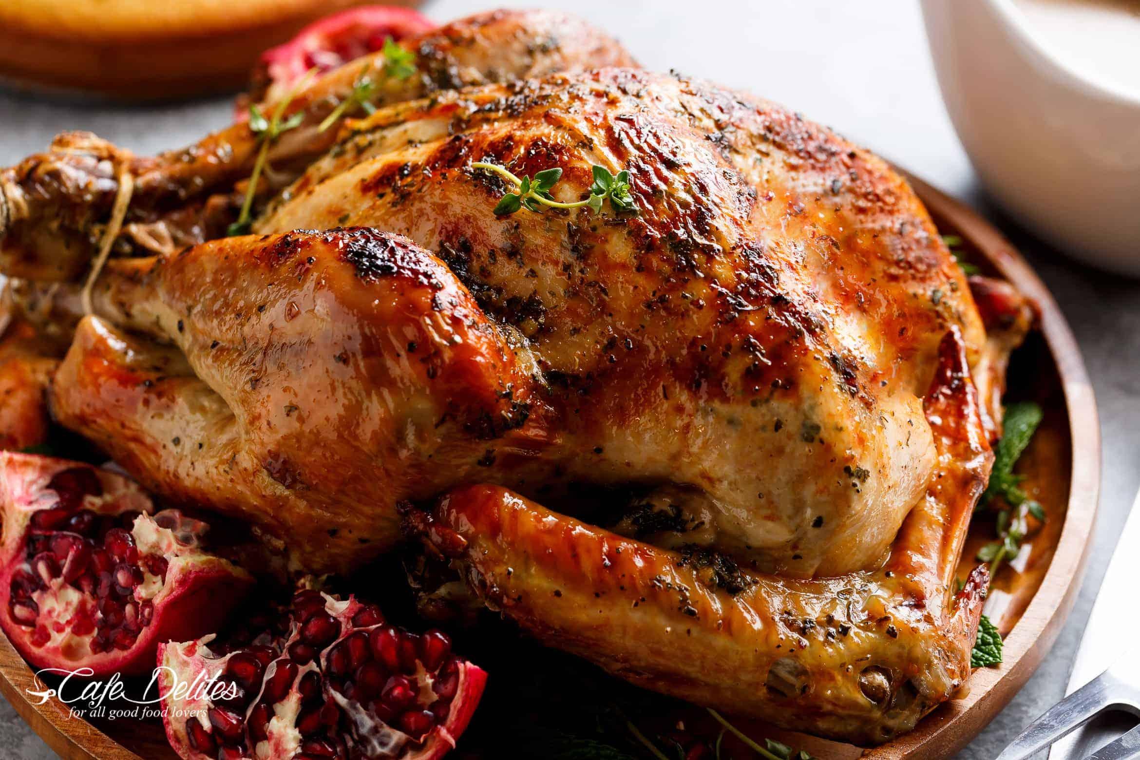 Close-up of a golden brown, crispy turkey skin after slow roasting.