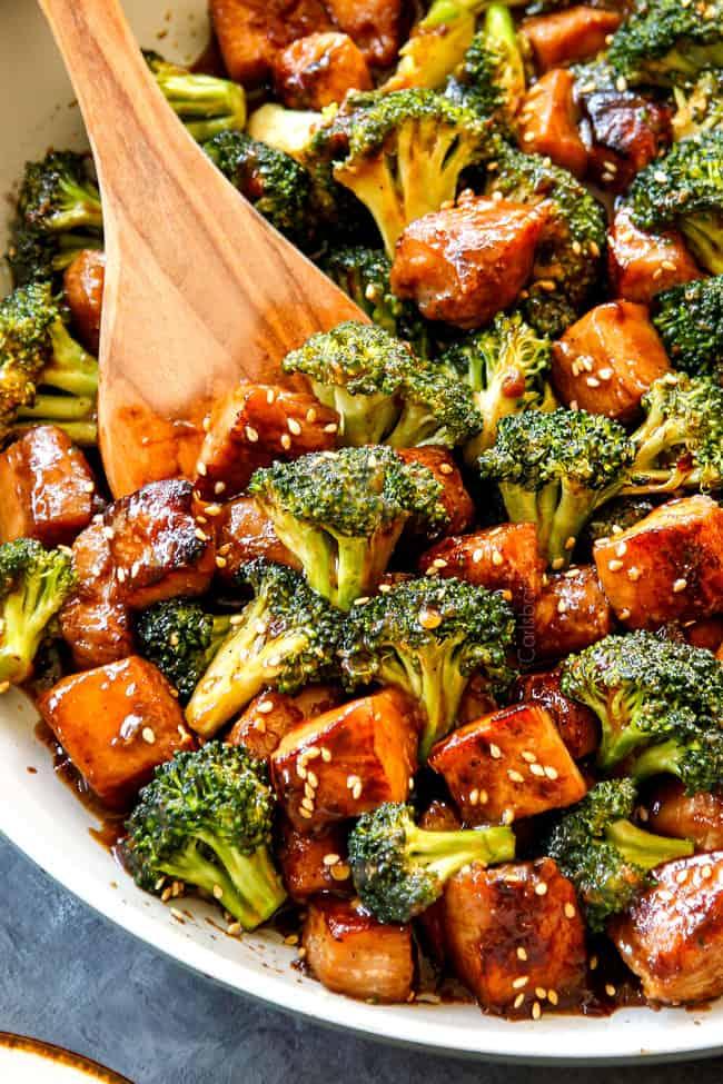 Close-up of chicken and broccoli sizzling in a wok