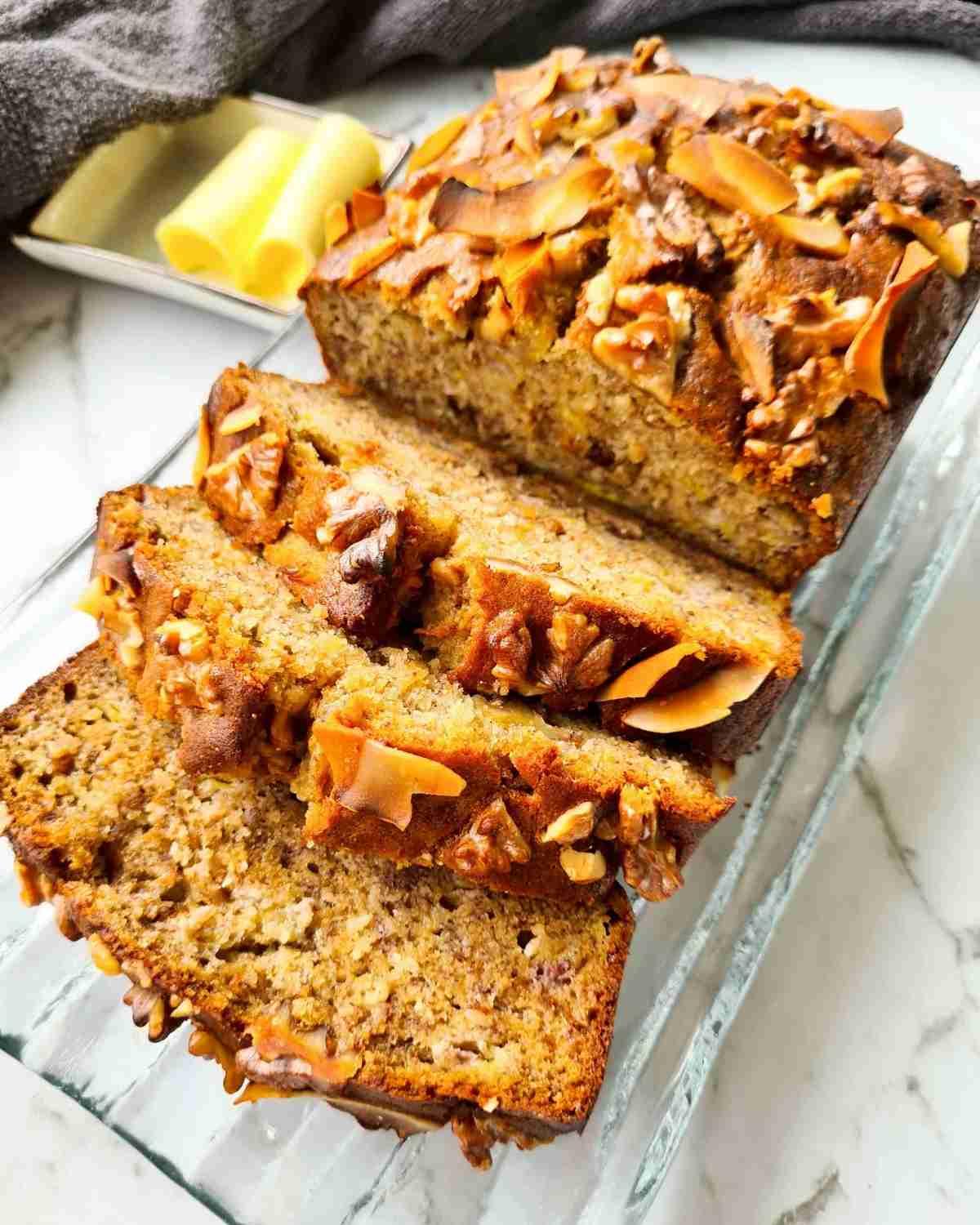 close-up of banana bread batter with chopped walnuts being folded in