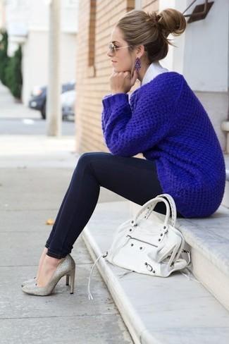 woman wearing blue sweater and matching blue earrings