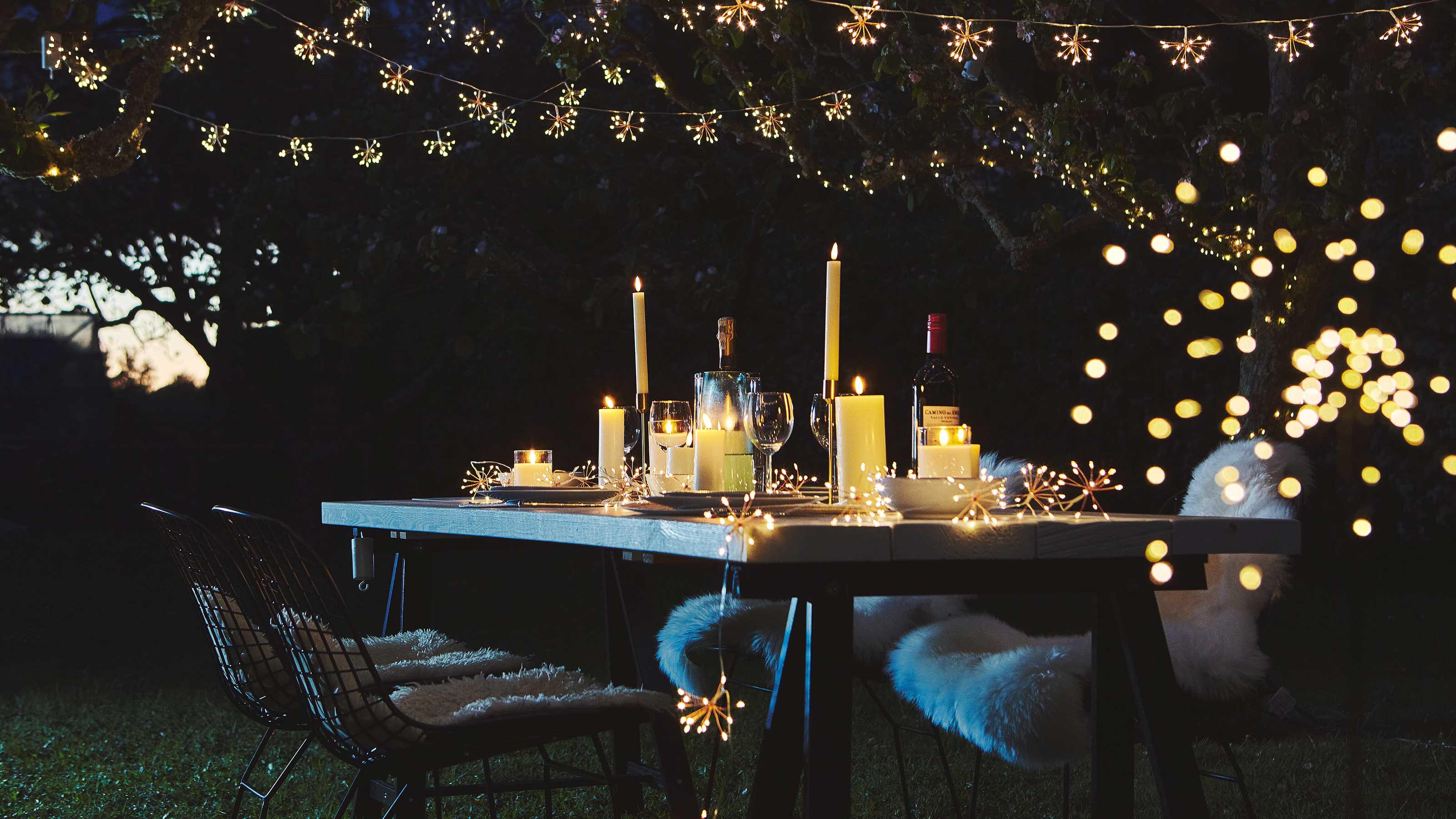 fairy lights and candles creating a warm ambiance in a party