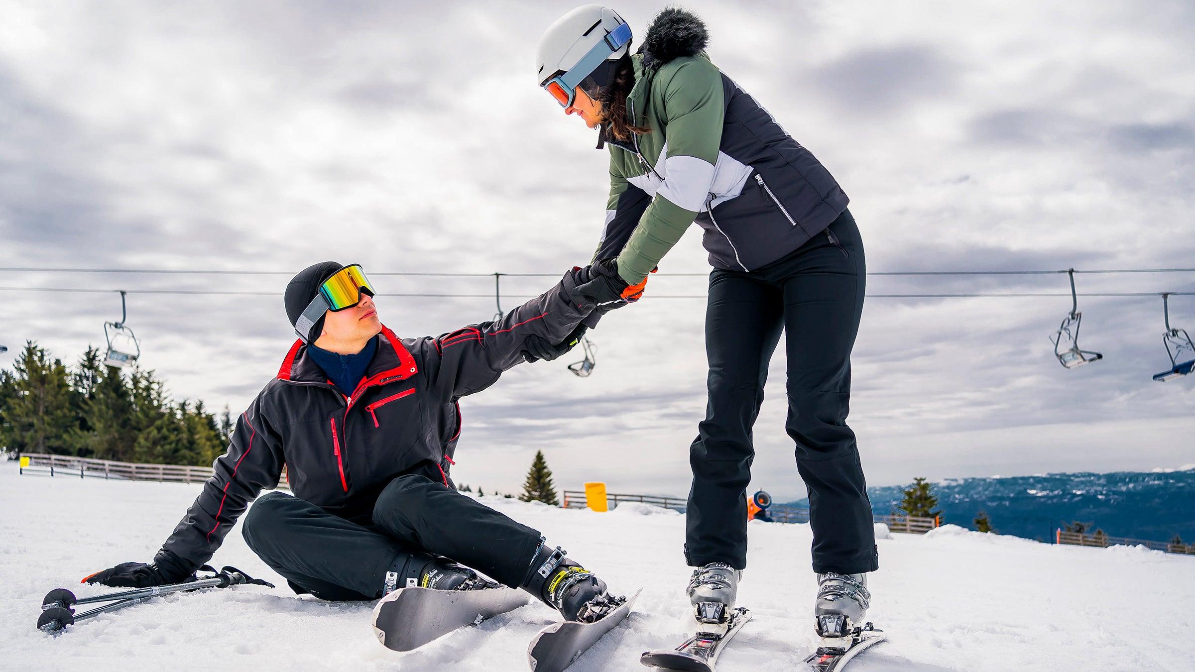 couple learning to ski