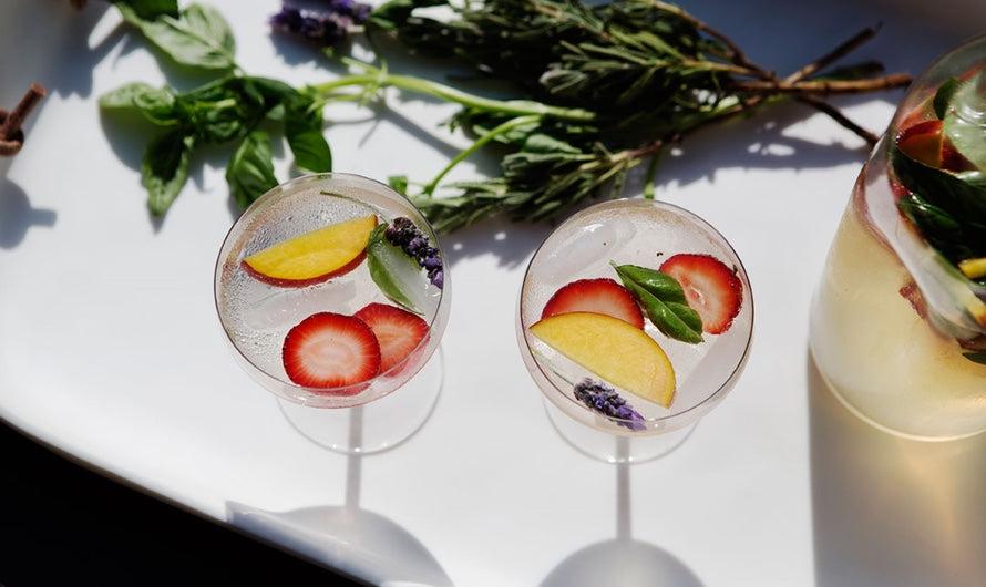 pitcher of Italian Summer Sangria with Peaches and Basil with summer landscape