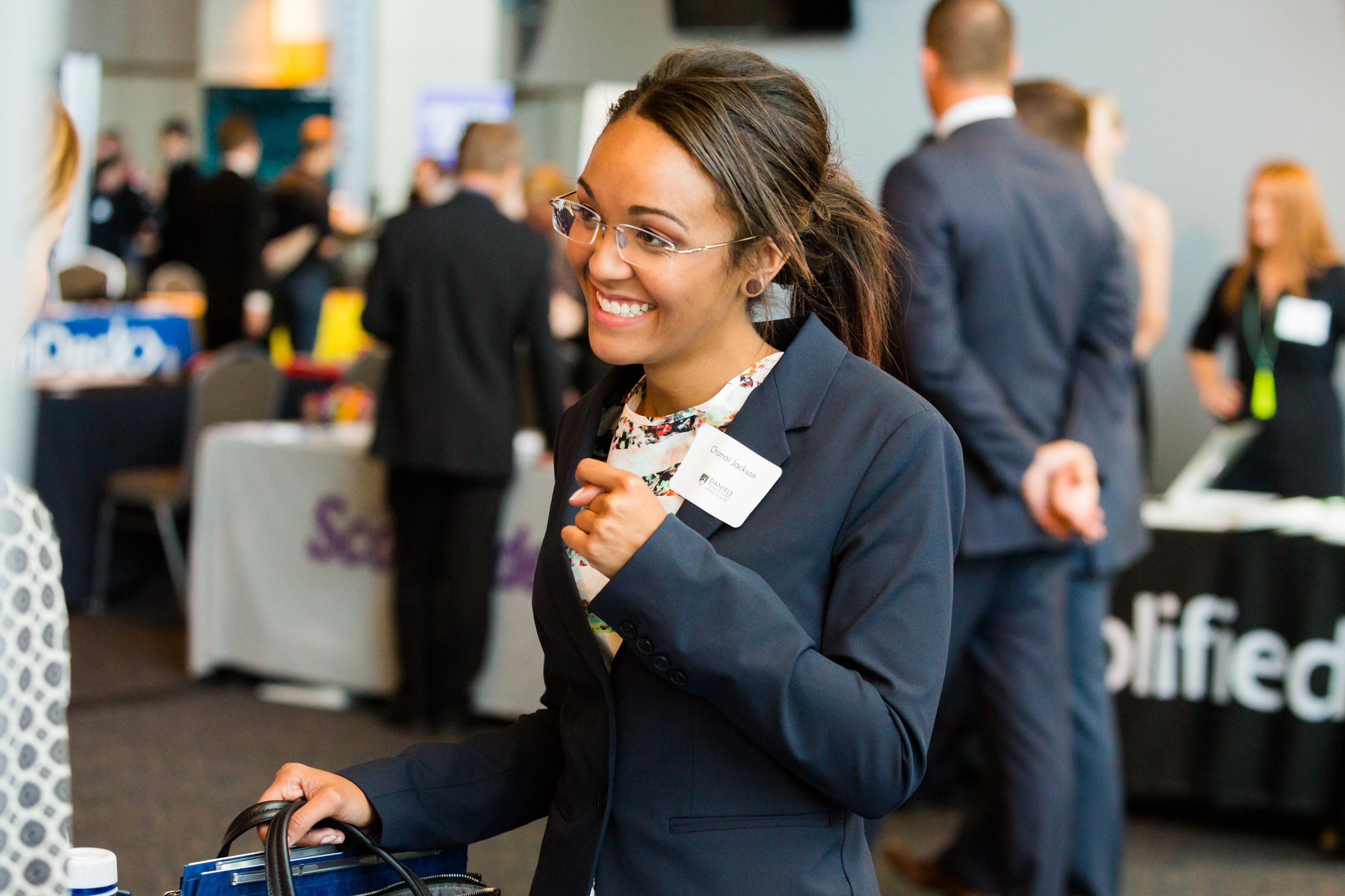 college student attending a career fair or networking event